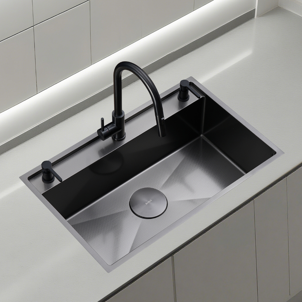 Oslo Lunar Gunmetal workstation sink with black pull-down faucet and black soap dispensers on a light countertop