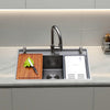 Oslo Honeycomb Natural workstation sink on a light kitchen counter with cutting board and colander in use