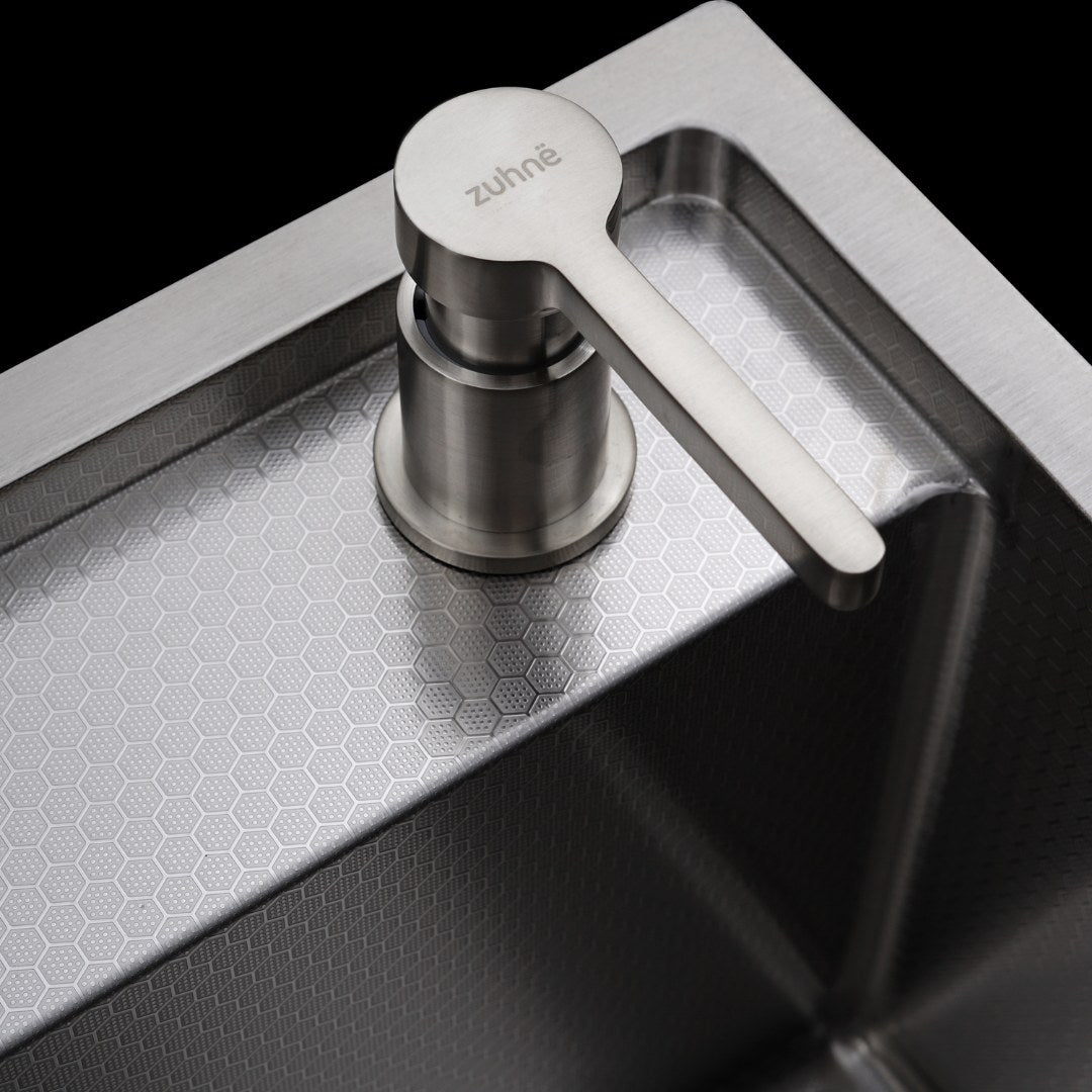 Close-up of the Honeycomb texture on the sink bowl beside the soap dispenser