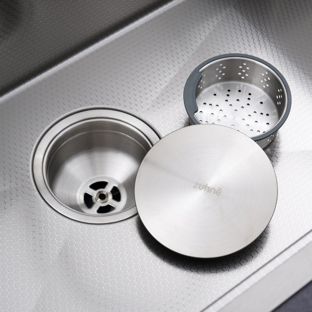 Two-stage strainer: top strainer, strainer basket and drain cover with the centre drain below