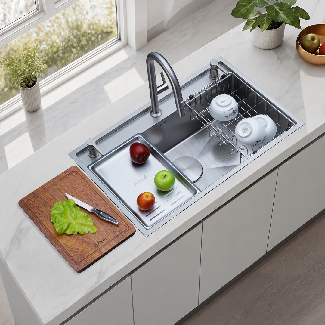 Oslo Lunar Natural workstation sink in a bright kitchen with cutting board, defrosting tray and drying rack in use