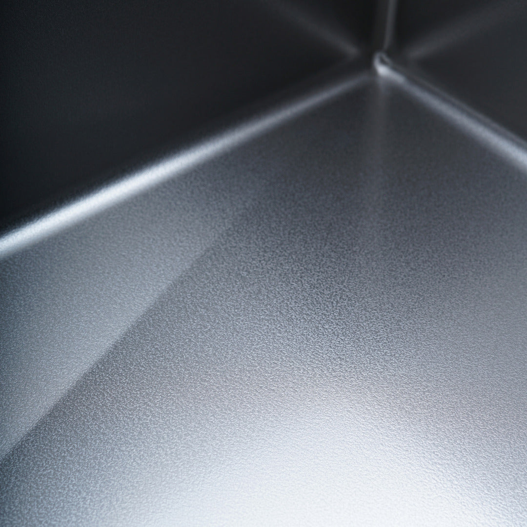 Close-up of the fine Lunar texture on the sink floor and corner
