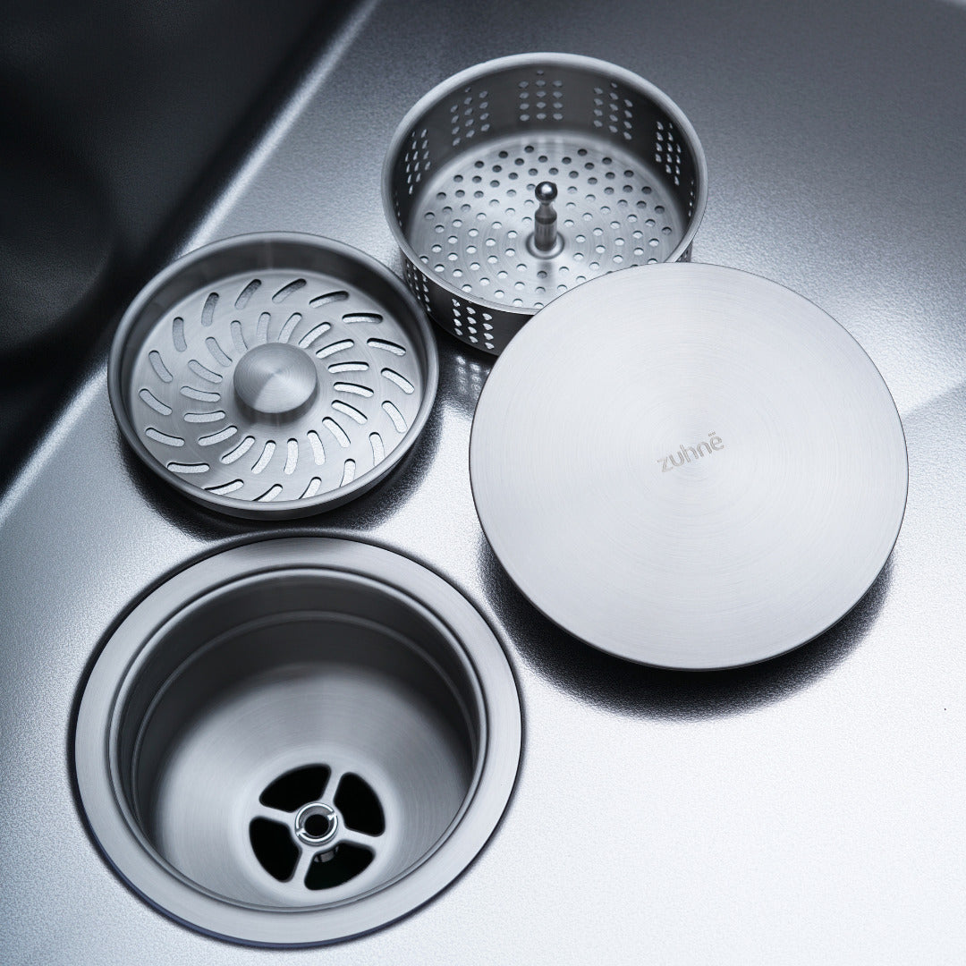 Two-stage strainer: top strainer, strainer basket and drain cover with the drain below