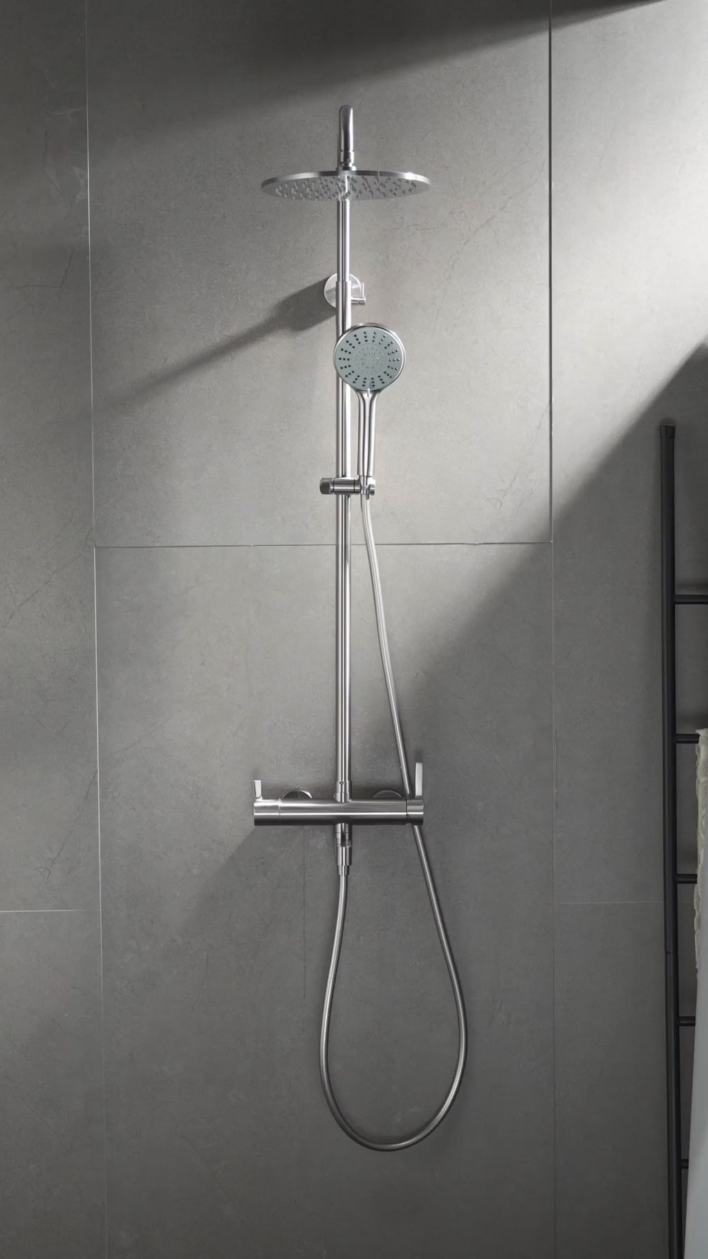 Rova Triple-Outlet shower set in use: mixing lever, swivel spout, handshower and rain shower